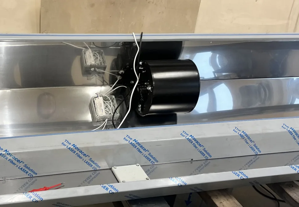Double inlet centrifugal blower installed inside a stainless duct section